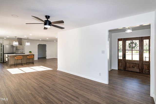 5920 Holly Dr, Raleigh, NC 27616 - unfurnished living room with dark wood-style floors, a ceiling fan, and recessed lighting
