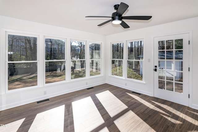 5920 Holly Dr, Raleigh, NC 27616 - unfurnished sunroom with wood finished floors, healthy amount of natural light, and a wooden deck