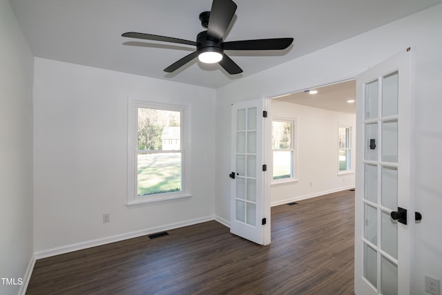 5920 Holly Dr, Raleigh, NC 27616 - unfurnished room featuring french doors, dark wood-style floors, and ceiling fan