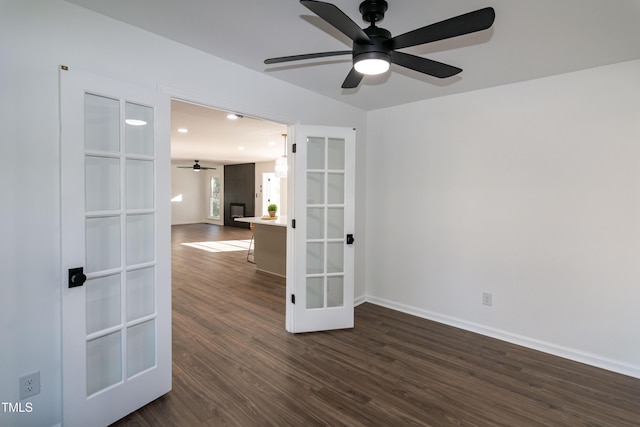 5920 Holly Dr, Raleigh, NC 27616 - empty room featuring ceiling fan, dark wood-style floors, recessed lighting, and french doors