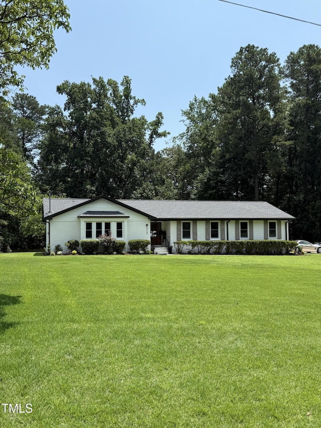 5920 Holly Dr, Raleigh, NC 27616 - ranch-style home with a front lawn