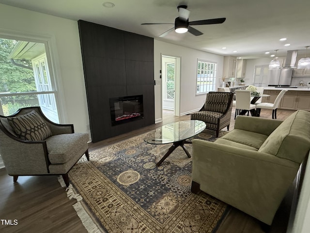 5920 Holly Dr, Raleigh, NC 27616 - living area with wood finished floors, a ceiling fan, recessed lighting, and a large fireplace