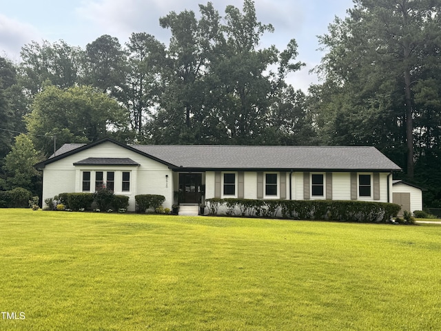 5920 Holly Dr, Raleigh, NC 27616 - ranch-style house featuring a front yard and roof with shingles