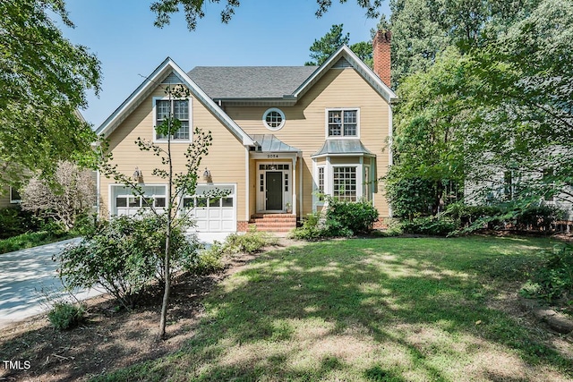 2054 Carriage Way, Chapel Hill, NC 27517 - traditional-style house with a chimney, concrete driveway, an attached garage, and a front lawn