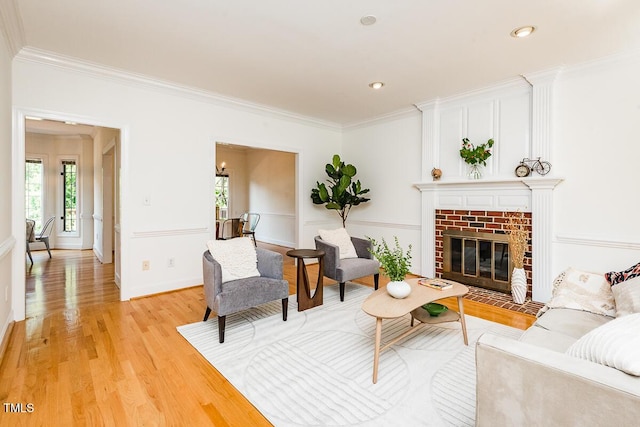 2054 Carriage Way, Chapel Hill, NC 27517 - living room featuring healthy amount of natural light, crown molding, light wood-style floors, a fireplace, and recessed lighting