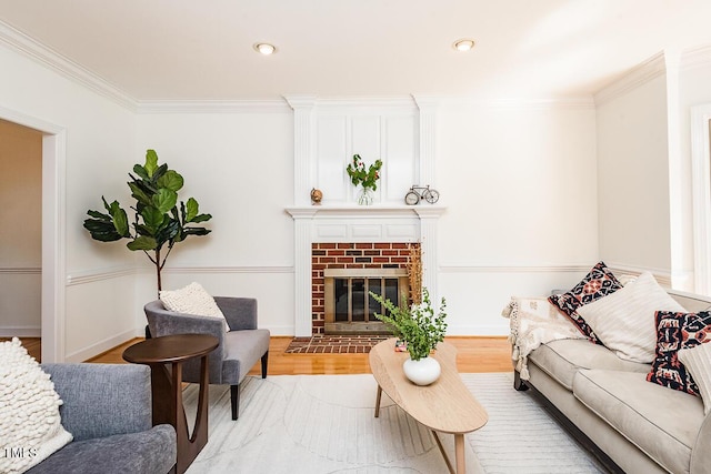 2054 Carriage Way, Chapel Hill, NC 27517 - living room with crown molding, wood finished floors, a brick fireplace, and recessed lighting