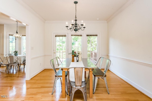 2054 Carriage Way, Chapel Hill, NC 27517 - dining room with a chandelier, healthy amount of natural light, ornamental molding, and light wood finished floors