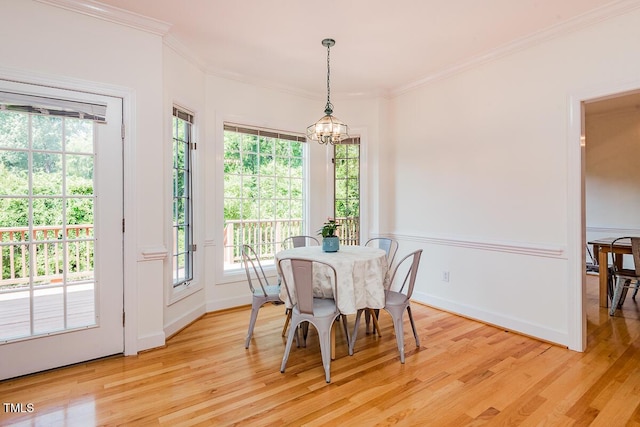 2054 Carriage Way, Chapel Hill, NC 27517 - dining room with a chandelier, ornamental molding, and light wood finished floors
