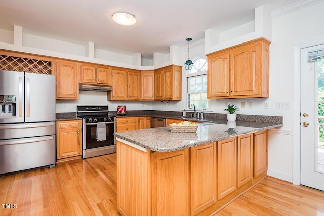 2054 Carriage Way, Chapel Hill, NC 27517 - kitchen with stainless steel appliances, under cabinet range hood, a peninsula, light wood-style floors, and dark stone countertops