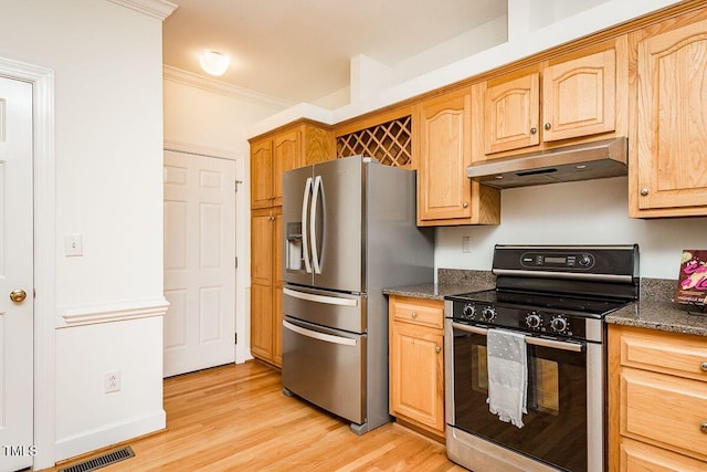 2054 Carriage Way, Chapel Hill, NC 27517 - kitchen with stainless steel appliances, under cabinet range hood, light wood finished floors, ornamental molding, and dark stone countertops