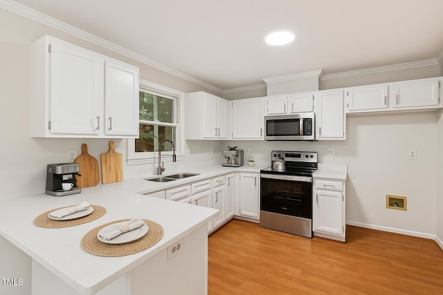 3405 E Jameson Rd, Raleigh, NC 27604 - kitchen featuring appliances with stainless steel finishes, light countertops, white cabinets, ornamental molding, and a peninsula