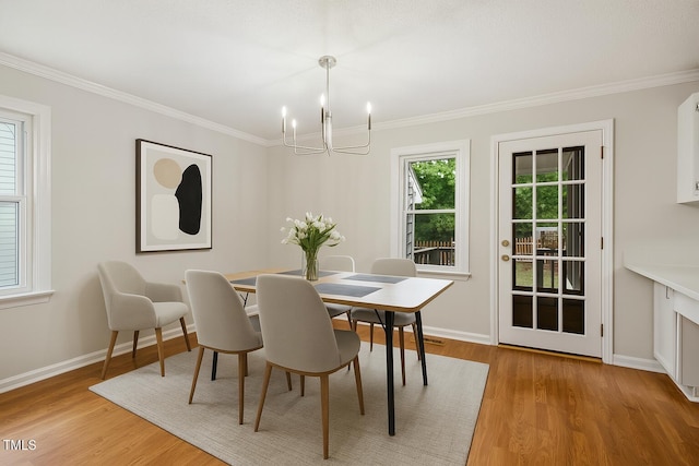 3405 E Jameson Rd, Raleigh, NC 27604 - dining space with a chandelier, wood finished floors, and ornamental molding