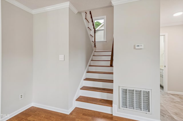 3405 E Jameson Rd, Raleigh, NC 27604 - stairway with crown molding and wood finished floors