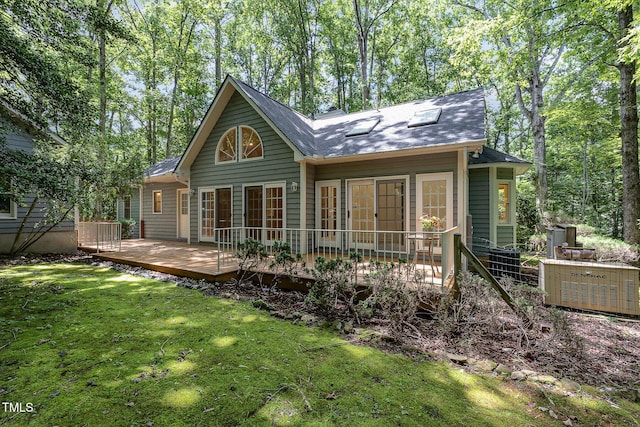 23 Lauren Ct, Pittsboro, NC 27312 - back of property featuring a lawn, a wooden deck, and a shingled roof