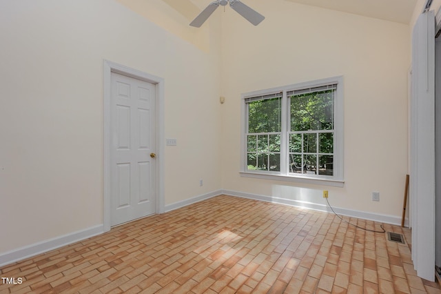 23 Lauren Ct, Pittsboro, NC 27312 - spare room with a ceiling fan, brick patterned flooring, and high vaulted ceiling