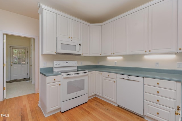 23 Lauren Ct, Pittsboro, NC 27312 - kitchen featuring white appliances, light wood-style flooring, and white cabinetry
