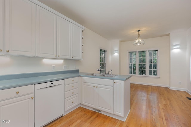 23 Lauren Ct, Pittsboro, NC 27312 - kitchen featuring dishwasher, a peninsula, white cabinets, and light wood-style flooring