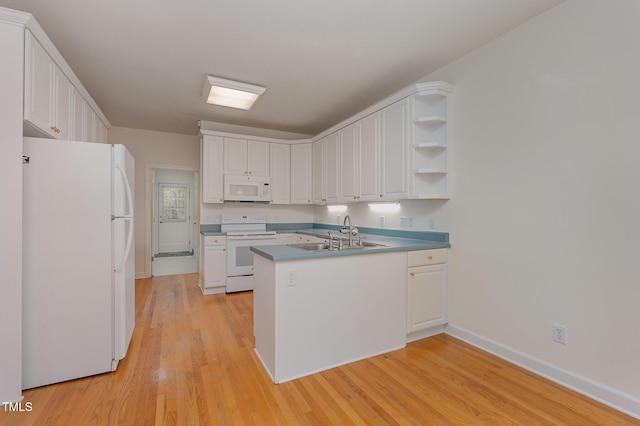 23 Lauren Ct, Pittsboro, NC 27312 - kitchen with white appliances, a peninsula, and white cabinetry