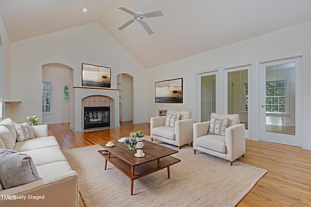 23 Lauren Ct, Pittsboro, NC 27312 - living area featuring high vaulted ceiling, a ceiling fan, light wood-style flooring, healthy amount of natural light, and arched walkways