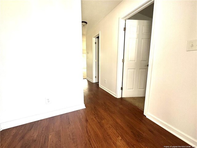 208 Waterdown Dr Unit 10, Fayetteville, NC 28314 - hall with dark wood-type flooring and baseboards