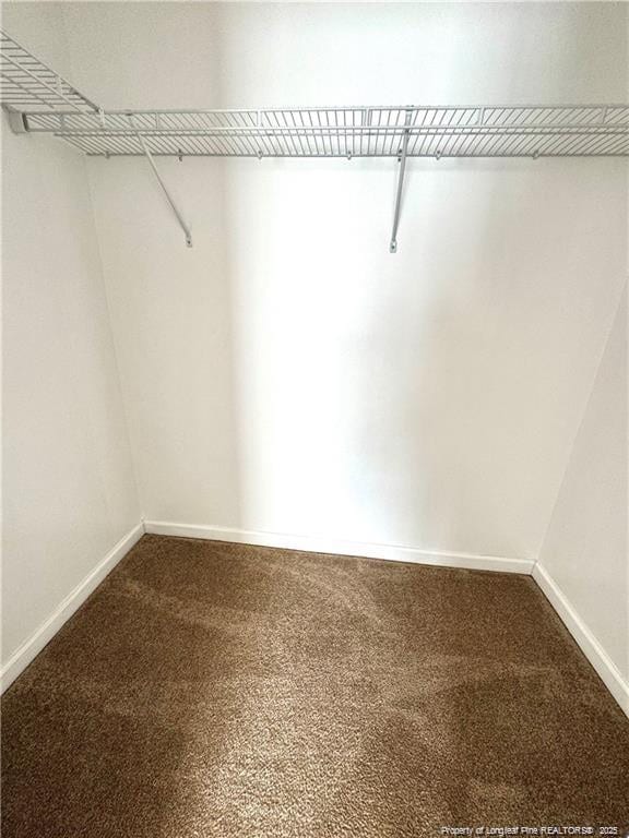 208 Waterdown Dr Unit 10, Fayetteville, NC 28314 - walk in closet featuring dark colored carpet
