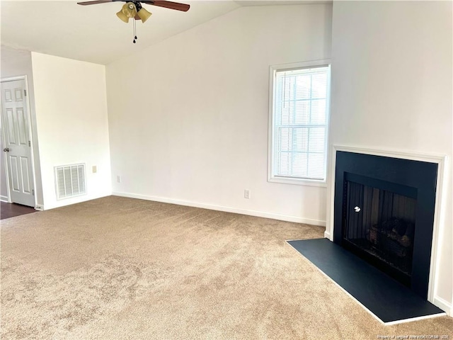 208 Waterdown Dr Unit 10, Fayetteville, NC 28314 - unfurnished living room featuring ceiling fan, dark carpet, a fireplace with flush hearth, and vaulted ceiling