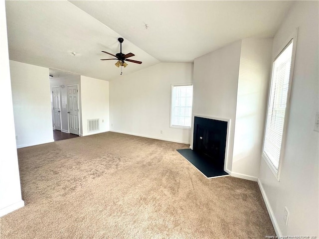 208 Waterdown Dr Unit 10, Fayetteville, NC 28314 - unfurnished living room with dark carpet, ceiling fan, a fireplace with flush hearth, and lofted ceiling