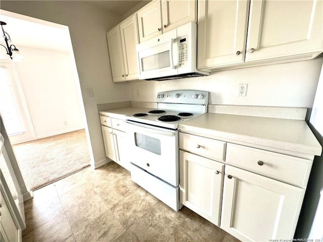 208 Waterdown Dr Unit 10, Fayetteville, NC 28314 - kitchen featuring white appliances, light countertops, light colored carpet, and white cabinets