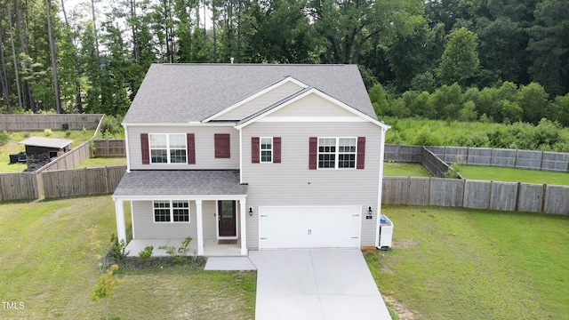 67 Red Cedar Way, Fuquay Varina, NC 27526 - traditional-style house with an attached garage, roof with shingles, driveway, covered porch, and a front yard