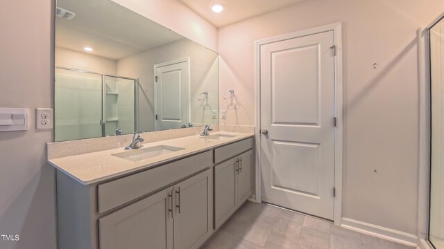 67 Red Cedar Way, Fuquay Varina, NC 27526 - full bath featuring double vanity, a shower with door, and recessed lighting