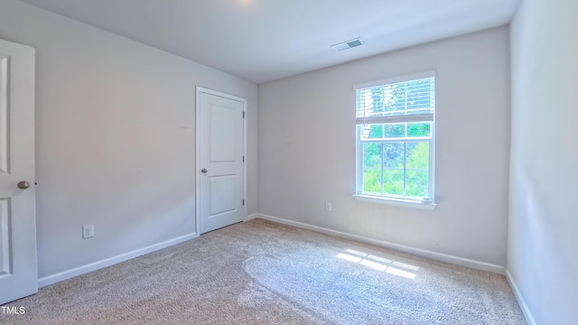 67 Red Cedar Way, Fuquay Varina, NC 27526 - spare room featuring carpet flooring