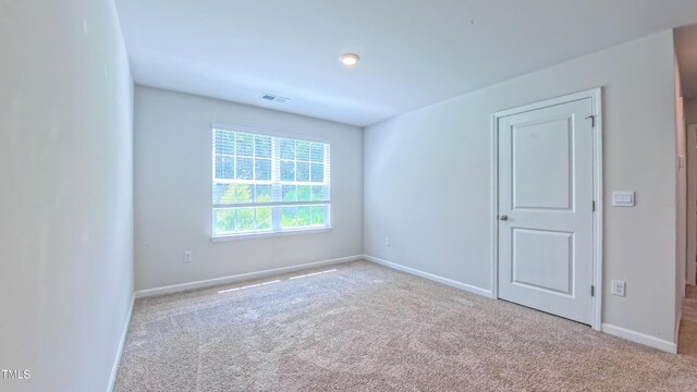 67 Red Cedar Way, Fuquay Varina, NC 27526 - carpeted empty room with baseboards