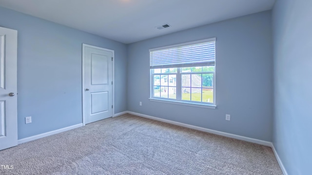 67 Red Cedar Way, Fuquay Varina, NC 27526 - carpeted empty room featuring baseboards
