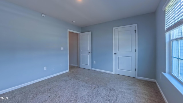 67 Red Cedar Way, Fuquay Varina, NC 27526 - unfurnished bedroom with carpet and baseboards