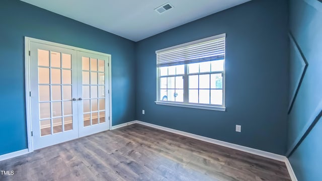 67 Red Cedar Way, Fuquay Varina, NC 27526 - spare room featuring french doors and wood finished floors