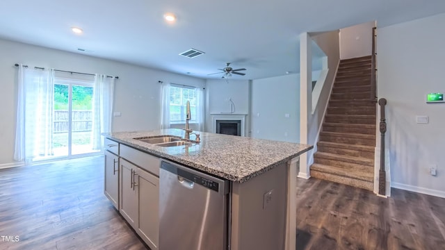 67 Red Cedar Way, Fuquay Varina, NC 27526 - kitchen featuring dishwasher, a fireplace, ceiling fan, dark wood-type flooring, and recessed lighting