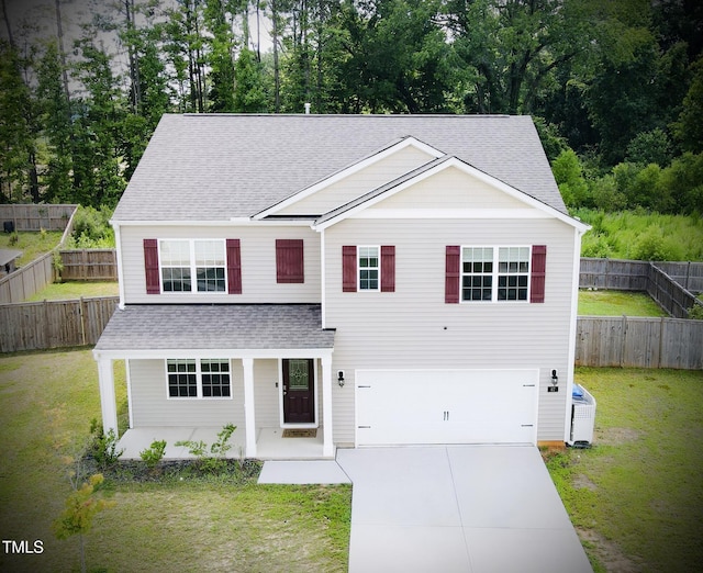 67 Red Cedar Way, Fuquay Varina, NC 27526 - traditional-style house featuring a shingled roof, concrete driveway, an attached garage, and a front yard