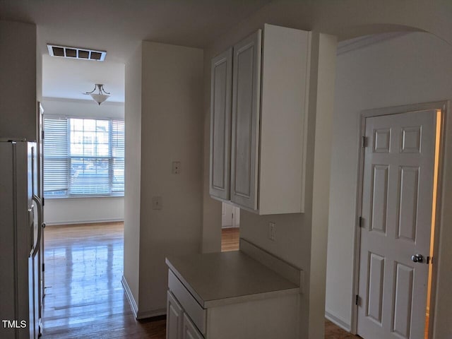 8253 City Loft Ct, Raleigh, NC 27613 - hallway featuring wood finished floors and arched walkways