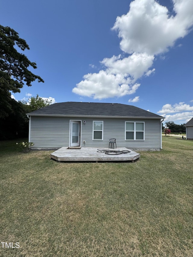 1617 Friendly Rd, Dunn, NC 28334 - back of house with a wooden deck and a lawn