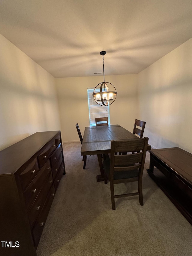 1617 Friendly Rd, Dunn, NC 28334 - dining area with carpet floors and a chandelier