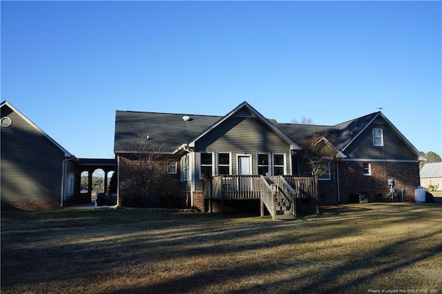 11282 NC Highway 41 N, Lumberton, NC 28358 - rear view of house with a deck, a yard, brick siding, and stairs