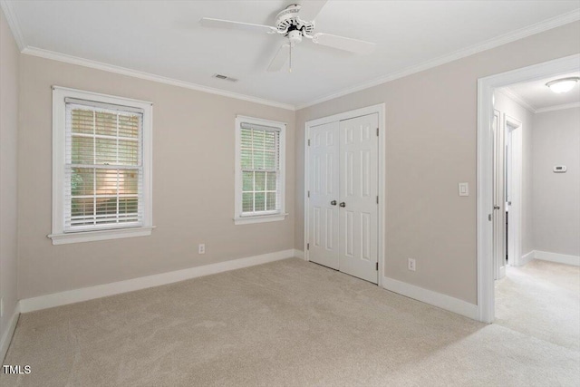 12329 Whartons Way, Raleigh, NC 27613 - unfurnished bedroom featuring light colored carpet, ornamental molding, a closet, and ceiling fan