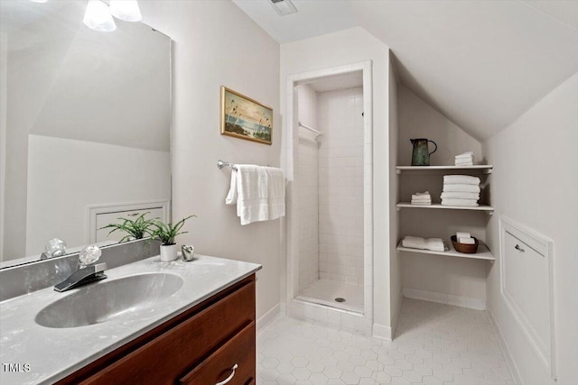 12329 Whartons Way, Raleigh, NC 27613 - bathroom with vanity, a shower stall, tile patterned floors, and vaulted ceiling