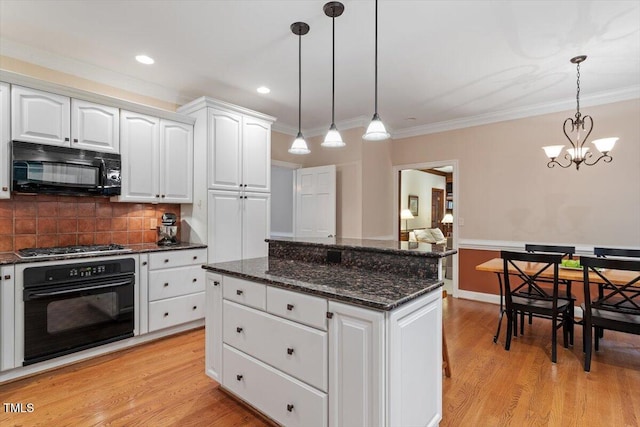 12329 Whartons Way, Raleigh, NC 27613 - kitchen featuring black appliances, a kitchen island, backsplash, dark stone counters, and pendant lighting