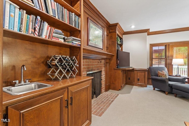 12329 Whartons Way, Raleigh, NC 27613 - office area featuring ornamental molding, wet bar, light colored carpet, a fireplace, and a wainscoted wall