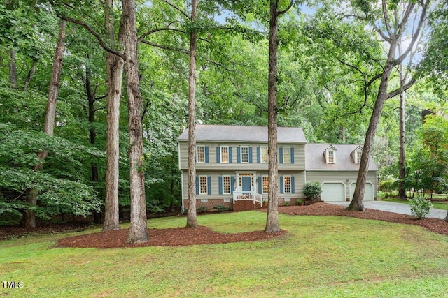 12329 Whartons Way, Raleigh, NC 27613 - view of front of house featuring driveway, a front lawn, and an attached garage