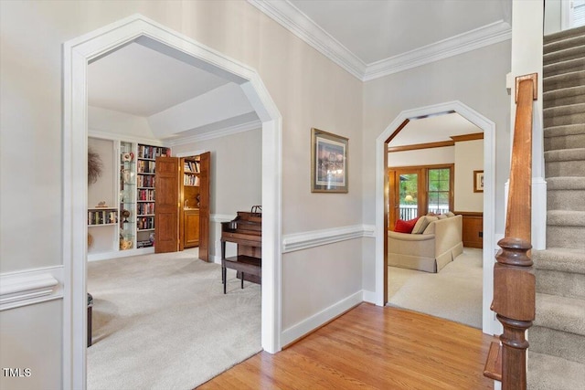 12329 Whartons Way, Raleigh, NC 27613 - carpeted foyer with ornamental molding, arched walkways, stairs, and wood finished floors