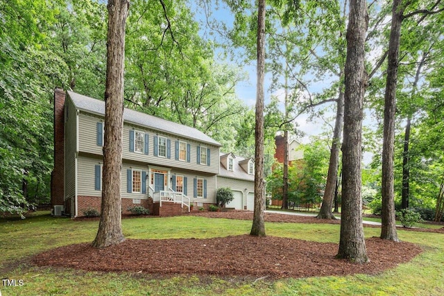 12329 Whartons Way, Raleigh, NC 27613 - view of front of property featuring a chimney, a front lawn, and an attached garage
