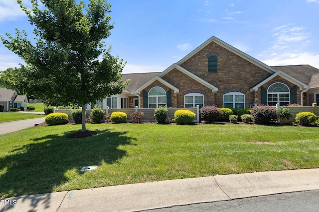 336 Faith Dr, Gibsonville, NC 27249 - view of front of property featuring stone siding and a front lawn