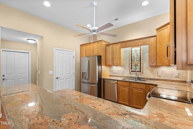 336 Faith Dr, Gibsonville, NC 27249 - kitchen with stainless steel appliances, a ceiling fan, backsplash, light stone countertops, and recessed lighting